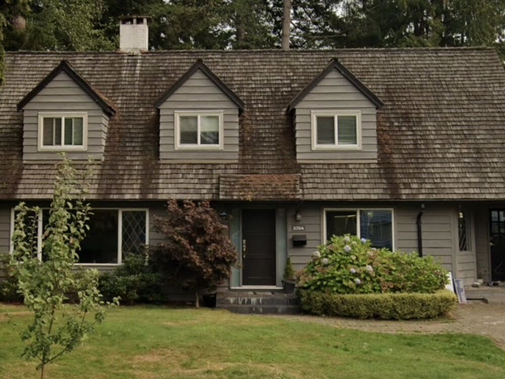 The same house by day with bare rooflines and no lights up